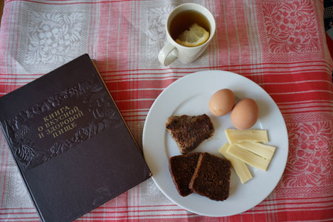 Brown bread, a slice of cheese, and boiled eggs - this is a breakfast made with the Soviet Book of Healthy and Tasty Food. Source: Anna Kharzeeva