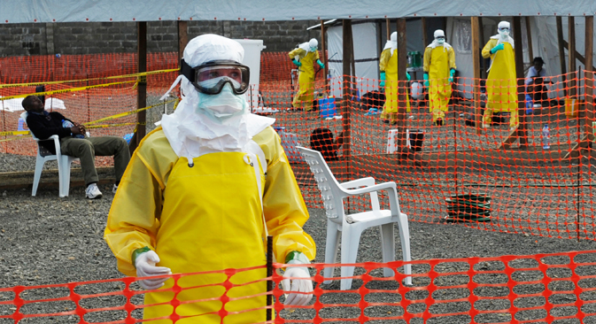 Medicins Sans Frontieres health workers prepare at ELWA's isolation camp during the visit of Senior United Nations System Coordinator for Ebola David Nabarro, at the camp in Monrovia August 23, 2014. As the outbreak has spread across borders from its initial epicentre in Guinea, governments in the region have introduced increasingly strict travel restrictions. Source: Reuters