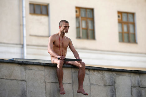 After the stunt: Pyotr Pavlensky cuts off his own earlobe. Source: Reuters