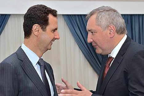 According to the Kommersant newspaper, Russia can allocate $1 billion in loans to Syria. Pictured: Dmitry Rogozin (right) and Bashar al-Assad.  Source: Press Photo