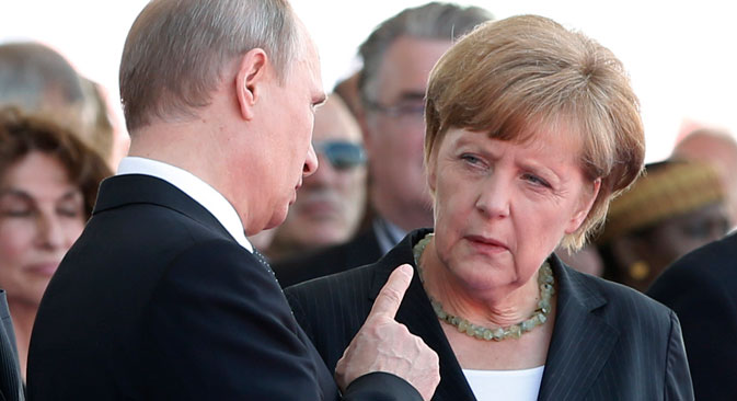 Russian President Vladimir Putin talks with German Chancellor Angela Merkel at a ceremony commemorating the 70th anniversary of D-Day on June 6, 2014. The two leaders recently took part in a telephone discussion alongside Ukrainian President Petro Poroshenko and his French counterpart Francois Hollande over the situation in eastern Ukraine. Source: Reuters