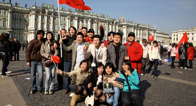 Chinese tourists taking pictures in front of the State Hermitage in St. Petersburg. Source: Photoxpress