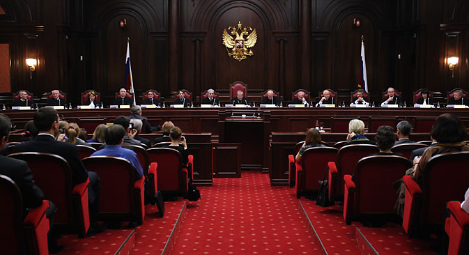 The deportation of HIV-positive foreign nationals who have families in Russia is unlawful, the Constitutional Court ruled on March 16. Source: Alexei Danichev / RIA Novosti