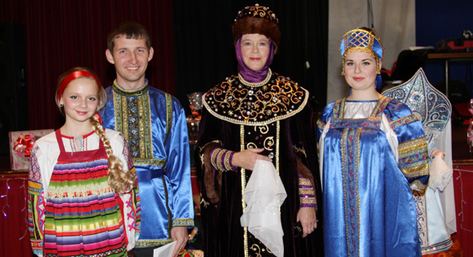 Russian community members in national costumes. Source: Edinenie