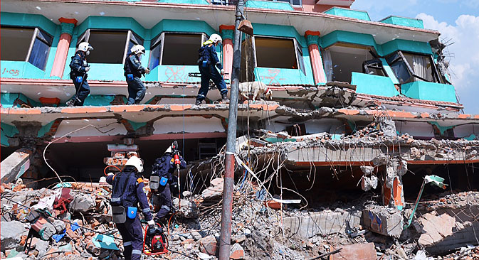 Rescue workers of the Russian emergency situations ministry clearing debris in the aftermath of a 7.8-magnitude earthquake that struck Nepal on April 25, 2015. Alexei Shtokal/TASS