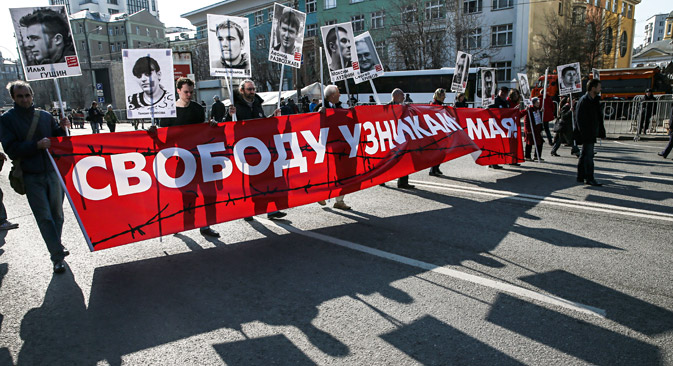 Russian opposition activists carry portraits of activists and placards reading 'Freedom to the prisoners of 06 May 2012' during a rally in support of freedom of press in downtown Moscow. April 13, 2014. Source: EPA