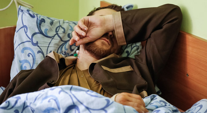 Yevgeny Yerofeyev lies on a bed at a hospital in Kiev, Ukraine, 19 May 2015. Ukraine claims that Yerofeyev is one of two Russian soldiers captured in eastern Ukraine. Source: EPA