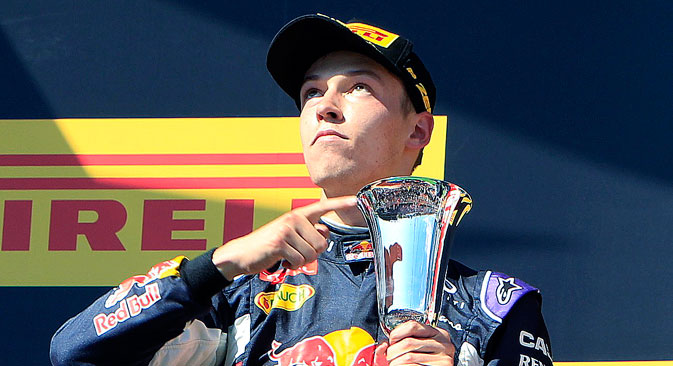 Daniil Kvyat points to his cup after the Hungarian F1 Grand Prix at the Hungaroring circuit, near Budapest, July 26, 2015. Source: Reuters