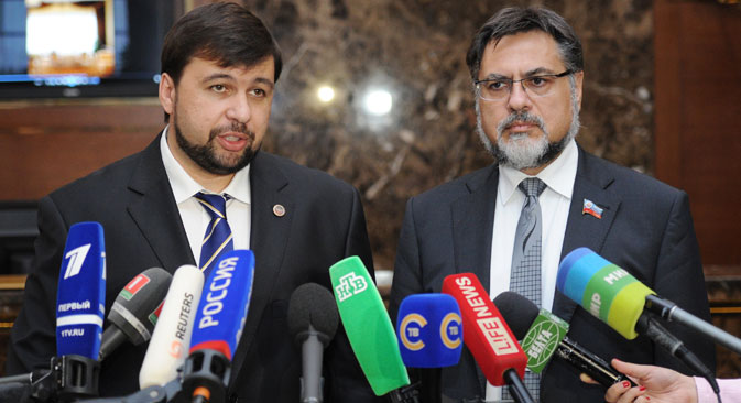 Deputy Chairman of the DNR Denis Pushilin and Representative of the LNR Vladislav Deinego are interviewed by journalists after a meeting of the Contact Group on settlement of the situation in the east of Ukraine held in Minsk, Aug. 26. Source: RIA Novosti / Vitaly Zalessky