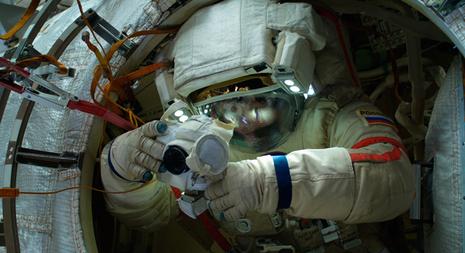 Taking a photo during a mission in open space outside the ISS. Source: Reuters