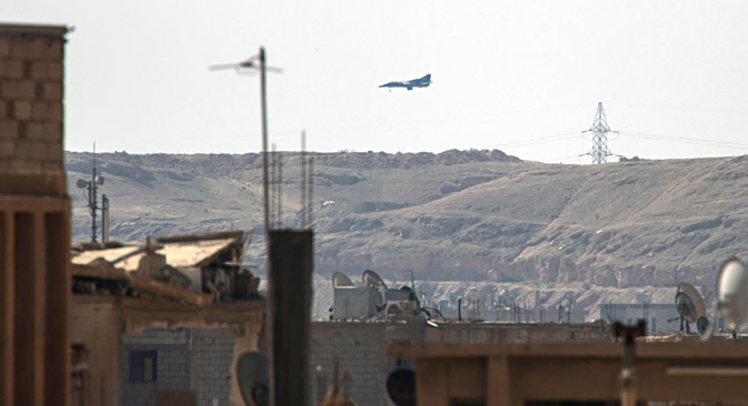 A MiG plane lands to resupply in the Hawiqah neighbourhood in the eastern Syrian town of Deir Ezzor on February 26, 2013. Source: AFP / East News