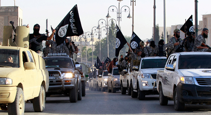ISIS fighters parade through the Syrian city of Raqqa, considered the capital of the movement. Source: Reuters