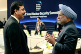 Pakistani Prime Minister Yousuf Raza Gilani, left, talks with the Prime Minister of India Manmohan Singh at the Nuclear Summit in Seoul, South Korea, March, 27, 2012.