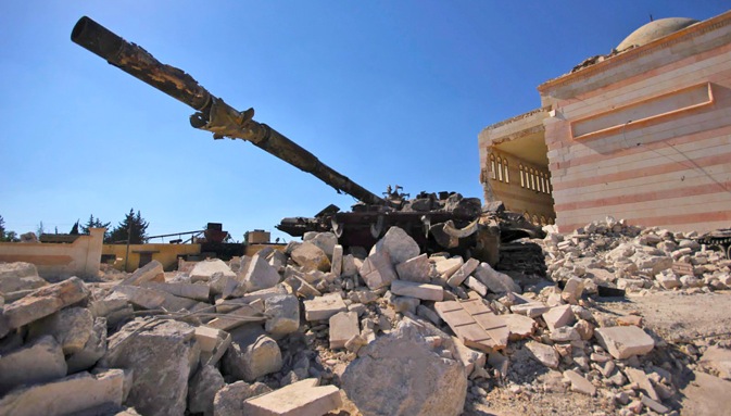 Destroyed Russian tank under the rubble in front of Azaz´s mosque, north-western Syria. Source: Spike Rogers