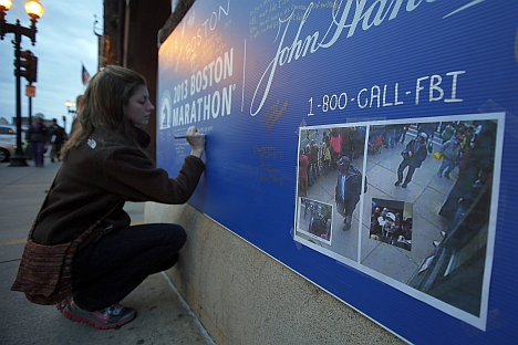 An American girl expressing her condolence to the victims of the Boston explosions. Source: Reuters