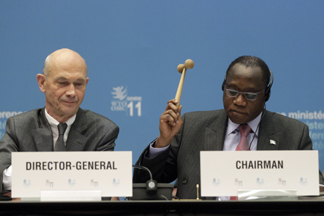 Conference Chairman Olusegun Olutoyin Aganga (R) uses a hammer next to WTO Director General Pascal Lamy to complete the accession of Russia to the WTO during the 8th WTO Ministerial Conference in Geneva, 2011. Source: Reuters