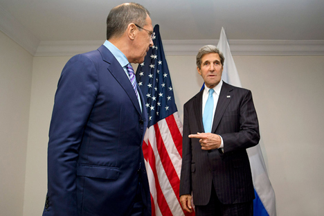 U.S. Secretary of State John Kerry gestures toward Russian Foreign Minister Sergey Lavrov (L), as he deflects a question from a reporter about whether they will discuss asylum for NSA leaker Edward Snowden, at the ASEAN summit in Brunei. Source: AP