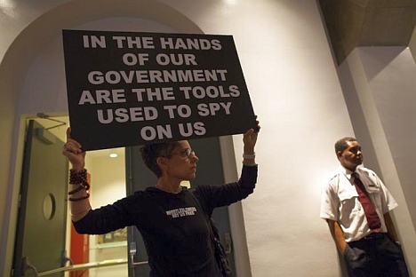 A woman holds up a sign at a support rally for Edward Snowden, a former NSA contractor who leaked documents to media outlets revealing the U.S. government's top-secret phone and Internet surveillance programs. Source: Reuters