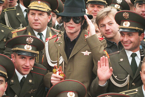 American popstar Michael Jackson makes a mock military salute, as he is surrounded by Russian army musicians on Moscow's World War II memorial. Source: AP