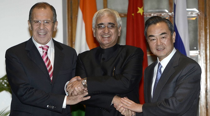 Chinese Foreign Minister Wang Yi (R), Indian External Affairs Minister Salman Khurshid (C) and Russian Foreign Minister Sergei Lavrov (L) at the meeting in New Delhi. Source: AP