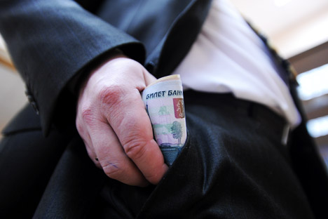 Corruption is a problem that plagues Russia and India. Source: Itar-Tass