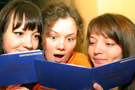 Having successfully passed the exam, the lucky student must give a high five to his pals still awaiting their turn. Source: ITAR-TASS