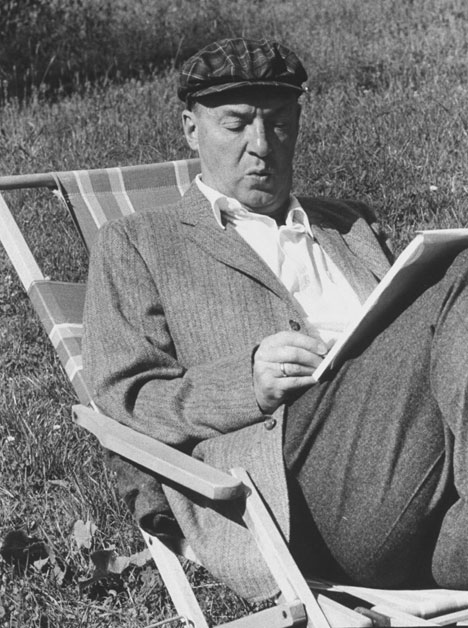 Vladimir Nabokov writing on paper in the garden. Source: Getty Images