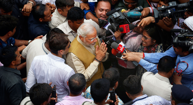Narendra Modi greets the media at the home of his 90-year-old mother in Gandhinagar, Gujarat, on May 16, 2014. Source: AP