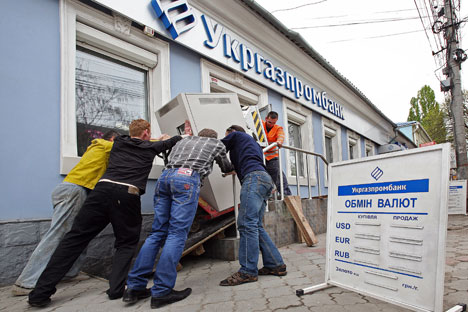 Ordinary people are finding it next to impossible to reach their money. Source: RIA Novosti
