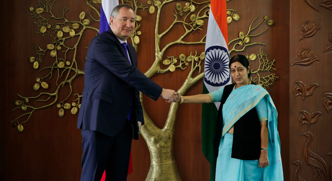 Russian Deputy Prime Minister Dmitry Rogozin and Indian Foreign Minister Sushma Swaraj, pose for the media before their meeting in New Delhi, June 18, 2014. Source: AP