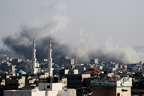 Smoke rise after an Israeli strike over Gaza City on August 8, 2014. Source: Photoshot