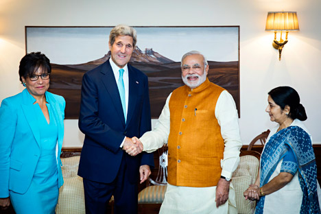 John Kerry shakes hands with Narendra Modi, as Indian Foreign Minister Sushma Swaraj, right, and U.S. Secretary of Commerce Penny Pritzker stand by their sides at Modi's residence in New Delhi on August 1, 2014. Source: AP 
