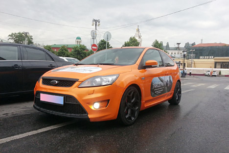 Moscovites earn money on placing advertising stickers on their vehicles. Source: Press photo