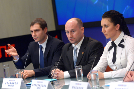 Members of the citizen action group of the Anti-Maidan public movement mixed martial arts world champion Yulia Berezikova (right), writer Nikolai Starikov (center) at a news conference "Contemporary Challenges: Revolutions, Illegal Acts; How to Protect Your Country From Collapsing." Source: Vladimir Trefilov / RIA Novosti