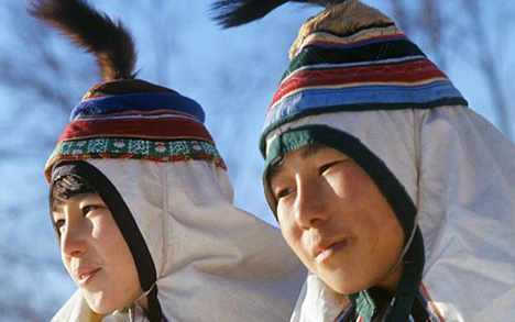 Young Udege people of the Amur region in their national costumes. Source: TASS / Yuri Muravin