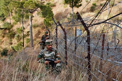 Indian army soldiers patrol near one of their forward posts at the Line of Control (LOC), that divides Kashmir between India and Pakistan. Source: AP
