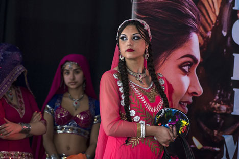 A young woman prepares to go on stage during the Holi Festival in Moscow. Source: Evgeny Biyatov / RIA Novosti