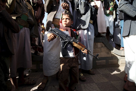 A boy stands among followers of the Houthi group during a demonstration against an arms embargo imposed by the U.N. Security Council on the group in Sanaa, on April 16. Source: Reuters