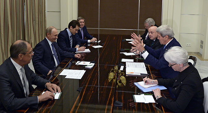 U.S. Secretary of State John Kerry and Russian President Vladimir Putin speak at the start of a bilateral meeting at the presidential residence of Bocharov Ruchey in Sochi, on May 12. Source: EPA