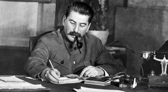 A reproduction photo of Joseph Stalin, General Secretary of the Central Committee of the All-Union Communist Party (Bolsheviks), in his office. Source: RIA Novosti