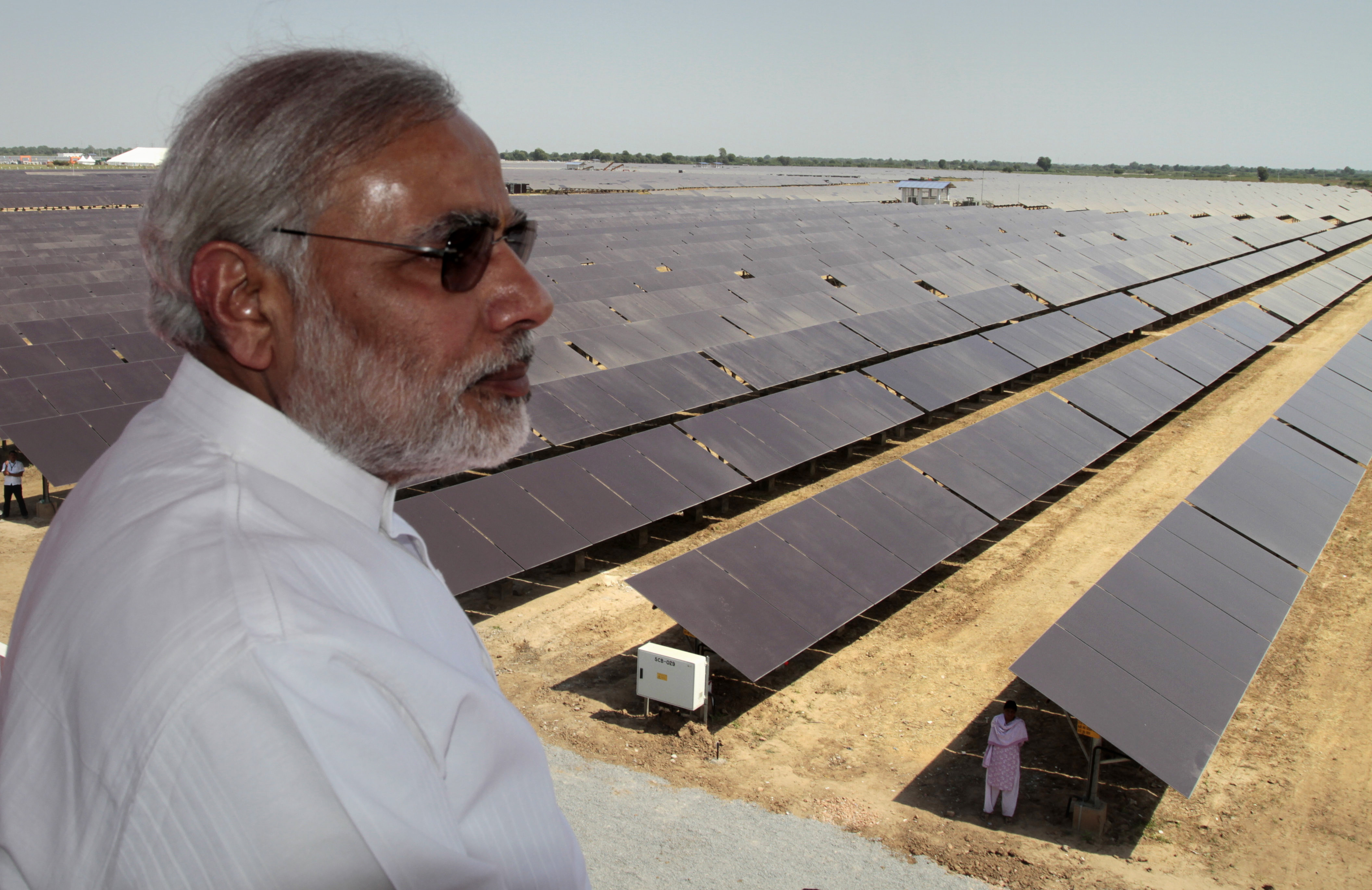 Narendra Modi overlooks the panels at a solar energy farm at Gunthawada in Gujarat state in 2011. 