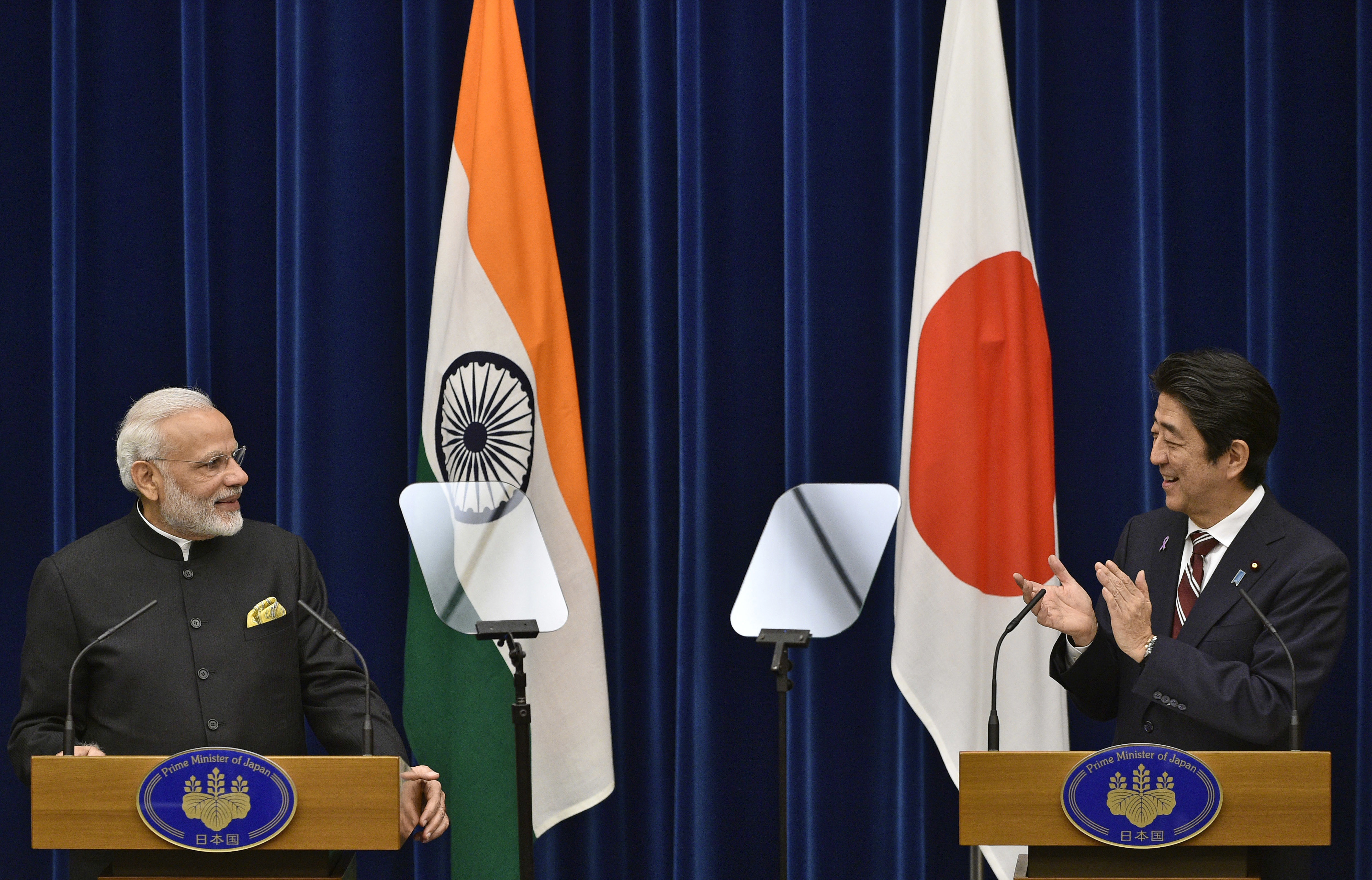 India's Prime Minister Narendra Modi (L) and Japan's Prime Minister Shinzo Abe attend a joint press conference at Abe's official residence in Tokyo on November 11, 2016.