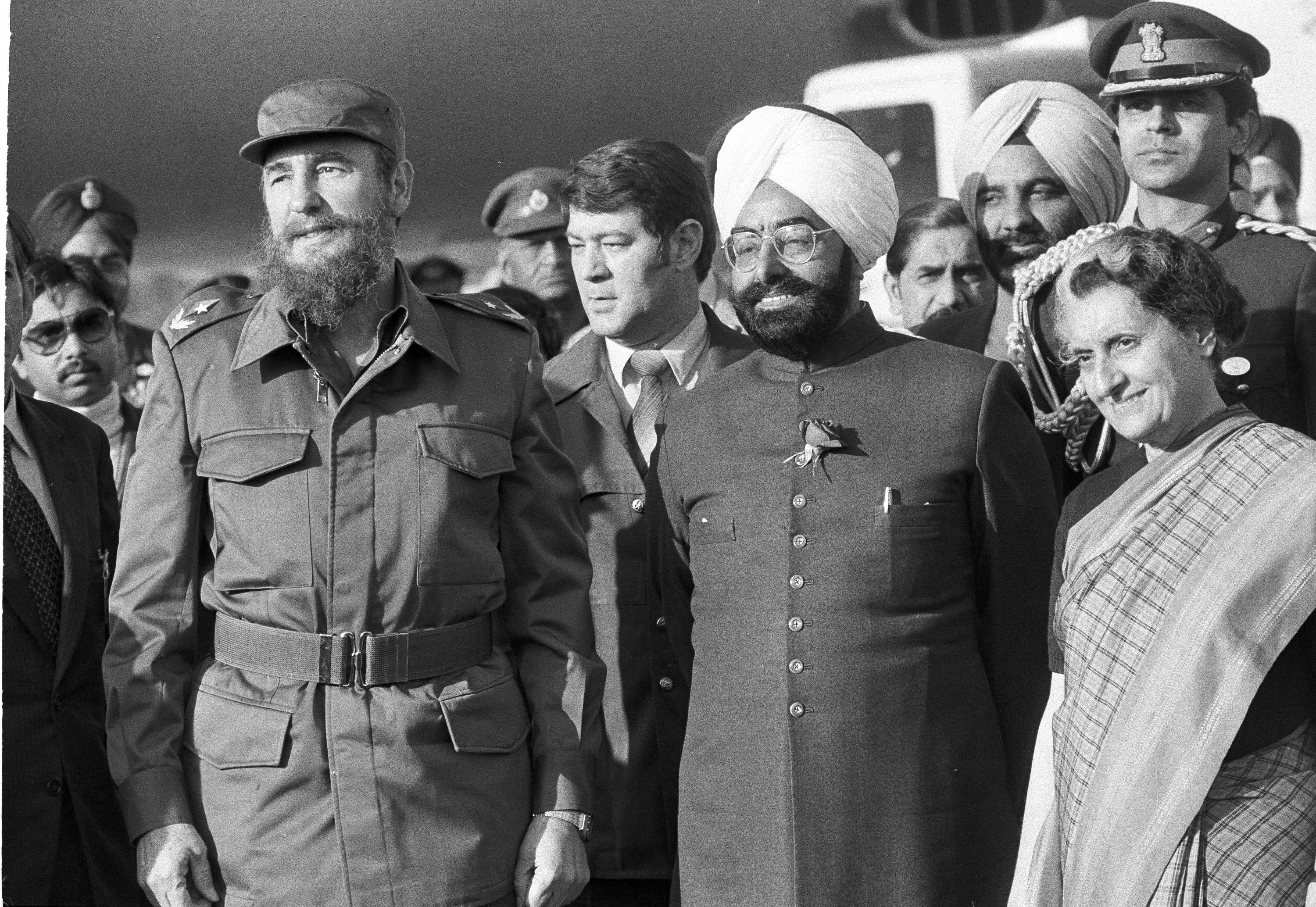 Cuban Prime Minister Fidel Castro, left, Indian President Zail Singh, and Indian Prime Minister Indira Gandhi pose for photographers after Castro arrived in New Delhi, March 6, 1983.
