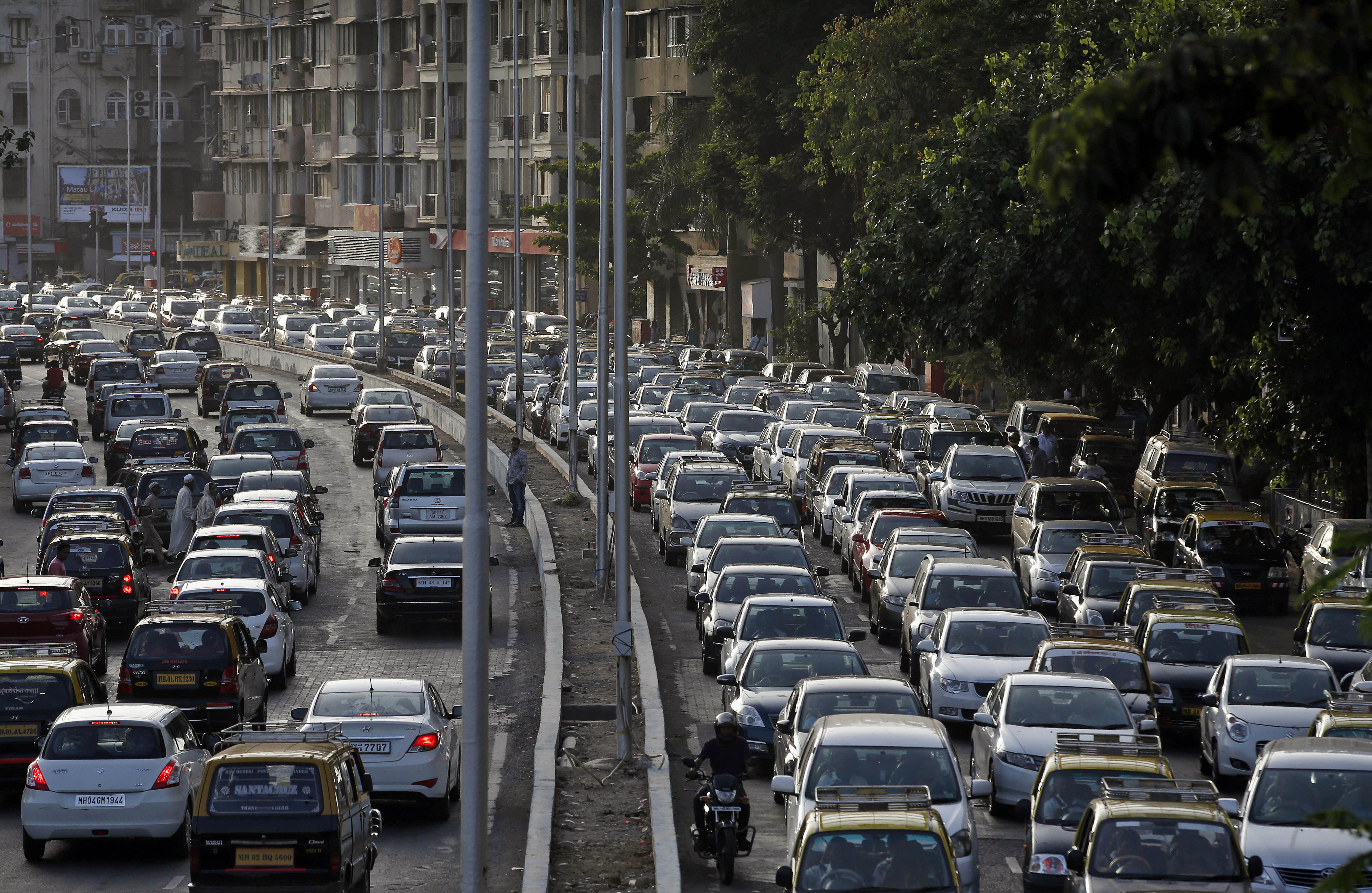 Traffic moves on a busy road in Mumbai.