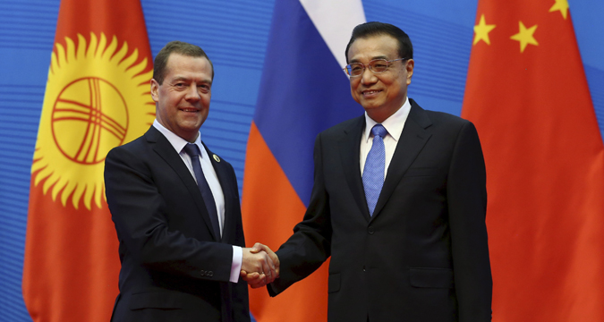 Russian Prime Minister Dmitry Medvedev and his Chinese Premier of the State Council of China Li Keqiang