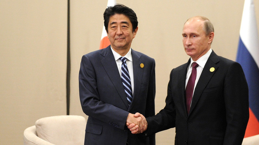 Мирный договор и немирный атом: о чём будут говорить в Москве Владимир Путин и Синдзо Абэ