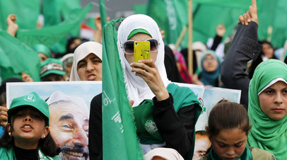 Сторонник движения исламского сопротивления ХАМАС во время публичного митинга в городе Газа