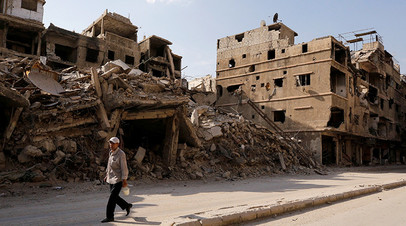 Улица в Дамаске, разрушенная в ходе конфликта в Сирии