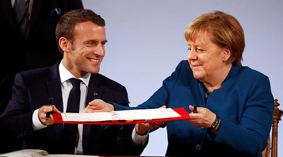 Ангела Меркель и Эммануэль Макрон подписывают Ахенское соглашение