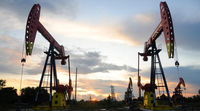 Pumpjacks are seen during sunset at the Daqing oil field in Heilongjiang province, China